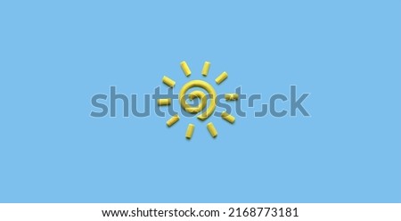 Spiral sun made of plasticine modeling clay, creative symbol of sunscreen concept. Summer or travel logo. Corporate graphic design.