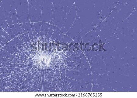 Broken glass texture on veri peri color background. Abstract of purple cracked screen smartphone from shock.