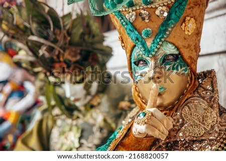 Venezia at the carnival with people wearing amazing masks Royalty-Free Stock Photo #2168820057
