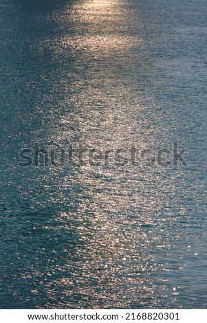 Sea surface with sunny shiny reflections