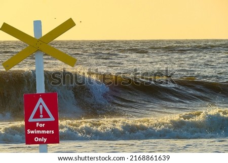 Sign in Front of Waves For Swimmers only 