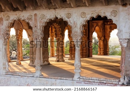 Beautiful arches of a pavilion lit by the evening lit during golden hour in the historic Lohagarh fort in Bharatpur in Rajasthan, India. Royalty-Free Stock Photo #2168866167