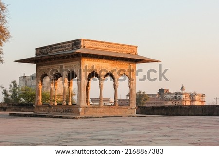 A beautiful ornate pavilion lit by evening light at the ancient Lohagarh fort in Bharatpur in Rajasthan, India. Royalty-Free Stock Photo #2168867383