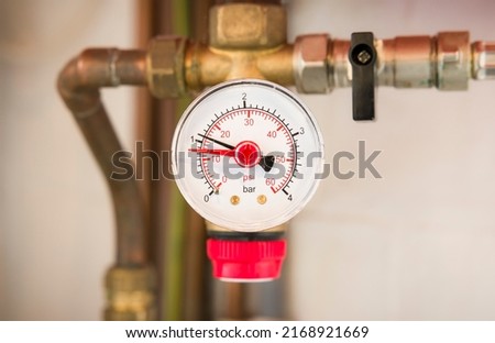 Pressure gauge on a sealed central heating system in a UK home Royalty-Free Stock Photo #2168921669