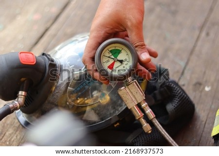 Fire service breathing apparatus with pressure gauge Royalty-Free Stock Photo #2168937573