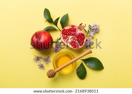 Flat lay composition with symbols jewish Rosh Hashanah holiday attributes on colored background, Rosh hashanah concept. New Year holiday Traditional. Top view with copy space. Royalty-Free Stock Photo #2168938011