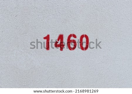 Red Number 1460 on the white wall. Spray paint.
