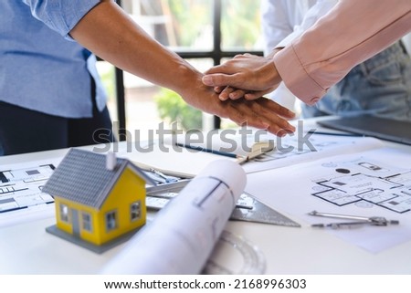 stack hands of business engineering and architect teamwork join together, construction engineer working  site, construction engineer conceptual,architect drawing on the architectural project