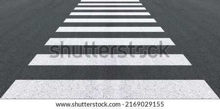 Crosswalk on the road for safety when people cross the road, crossing on a repaired asphalt road