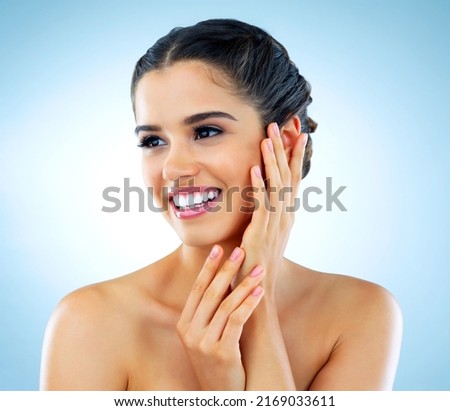 Theres no substitute for healthy glowing skin. Studio shot of a beautiful young woman with gorgeous skin posing against a blue background. Royalty-Free Stock Photo #2169033611