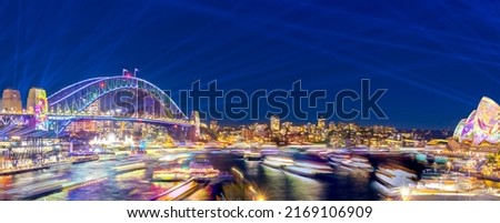 Colourful Light show at night on Sydney Harbour NSW Australia. The bridge illuminated with lasers and neon coloured lights  Royalty-Free Stock Photo #2169106909