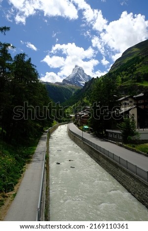 A picture of river in motion blur with Zermatt Village and Matterhorn insight. Zermatt, in southern Switzerland’s Valais canton, is a mountain resort renowned for skiing, climbing and hiking.