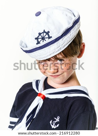Cute little carroty boy dressed in sailor suit