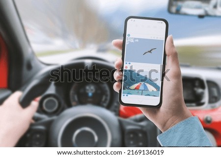 Distracted driver using a smartphone while driving the car