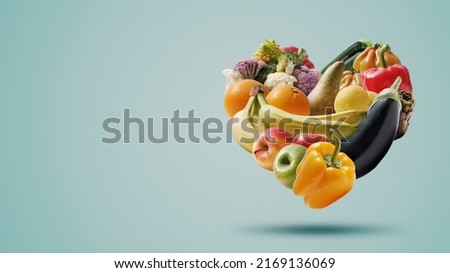 Fruits and vegetables arranged in a heart shape, healthy food and nutrition concept, isolated