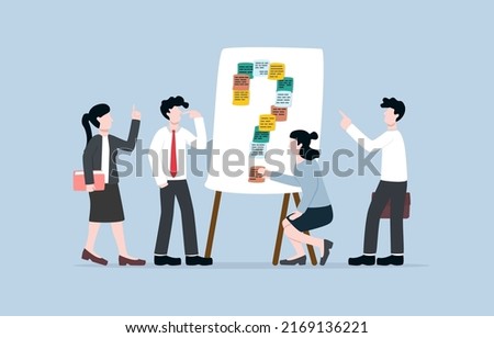 Discuss problems in organisation or company to resolve, team sharing issues or doubts in order to have smooth operation concept. Businesspersons attaching sticky notes to whiteboard as question mark. Royalty-Free Stock Photo #2169136221