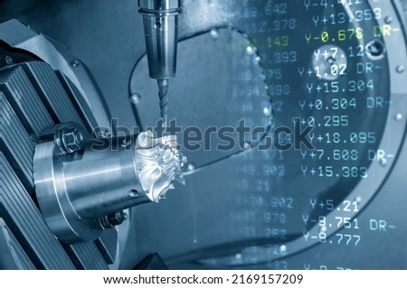 Abstract scene 5-axis machining center cutting the turbine  parts  parts with G-code data background . The hi-precision automotive manufacturing process by multi-axis CNC milling machine. Royalty-Free Stock Photo #2169157209