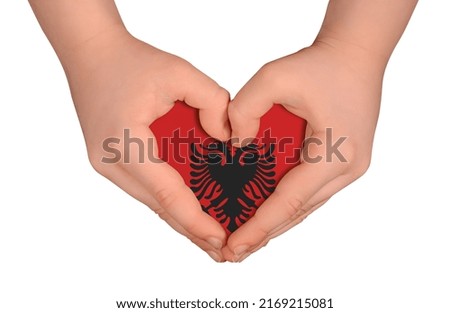 Kid's hands in heart- form. National peace concept on white background. Albania