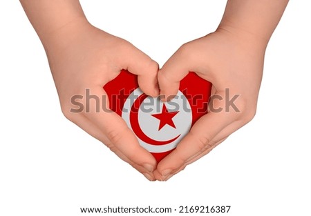 Kid's hands in heart- form. National peace concept on white background. Tunisia