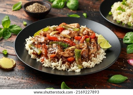 Stir fry pepper chicken with sweet peppers, onion, garlic and ginger Royalty-Free Stock Photo #2169227893