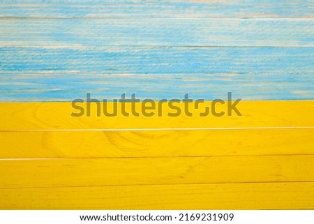 Yellow-blue wooden background. Painted wooden board. Detail for design. design elements. macro. full focus. Background for business cards, postcards and posters