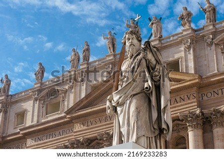 Statue of Apostle Paul in front of the St Peter's Basilica, Vatican, Rome, Italy. Detail of the facade exterior on the blue sky background. Renaissance sculpture of the Apostle Paul with a sword. Royalty-Free Stock Photo #2169233283