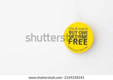 buy one get one free yellow button on white background Royalty-Free Stock Photo #2169238341