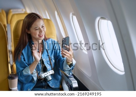 Travel, tourism business, portrait of a woman using her phone selfie on an airplane to post a profile picture of herself