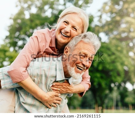 Happy active senior couple having fun outdoors. Portrait of an elderly couple together Royalty-Free Stock Photo #2169261115