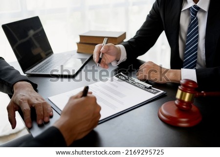 Businessman and lawyer discuss the contract document. Treaty of the law. Sign a contract business. Royalty-Free Stock Photo #2169295725