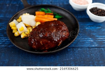 Hamburger and seasonings on the table