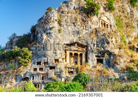 View of the Tomb of Amyntas in Fethiye, Turkey. The Lycian Rock Tombs at ancient Telmessos currently in Fethiye is a popular tourist attraction in Turkey. Royalty-Free Stock Photo #2169307001