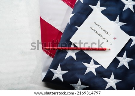 Voting ballot, red pencil and state american flag. Isolated on white background. Low angle view. There are no people in the photo. Agitation, elections, voting, Constitution, freedom of choice.