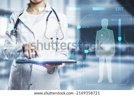 Medical examination online concept with digital health analyzing interface projected from digital tablet in doctor hands in medical gown on background, double exposure Royalty-Free Stock Photo #2169358721