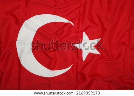 Turkish Flag background. Crescent and Star Flag of Turkey. Cloth fabric texture ensign background.  National day and country occasions concept.