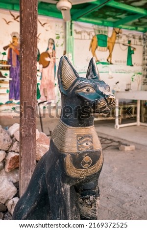 ancient Egyptian black sphynx cat in front of valley of the kings in Luxor Egypt