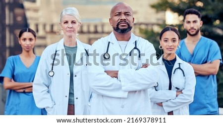 Were serious about our work. Shot of a group of doctors standing with their arms crossed in the city. Royalty-Free Stock Photo #2169378911