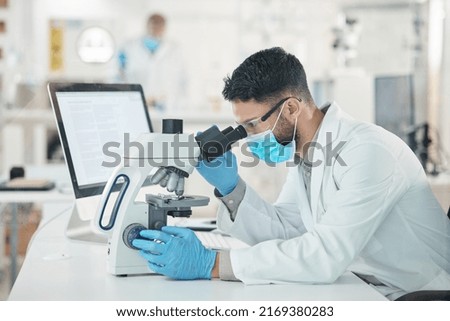 You have to look at it from different perspectives. Shot of a young scientist using a microscope in a lab. Royalty-Free Stock Photo #2169380283