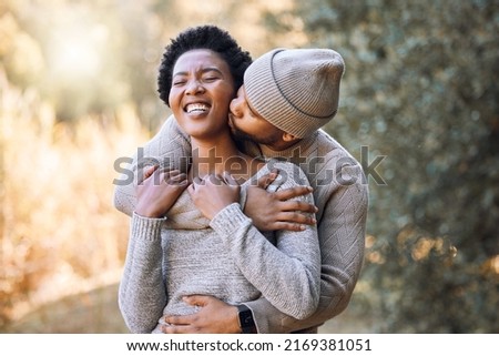 Theres nothing like spending time with you. Shot of a young man kissing his girlfriend during a camping trip.