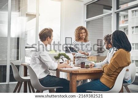 Its time to flex your problem-solving muscles. Shot of a group of businesspeople having a meeting in an office.