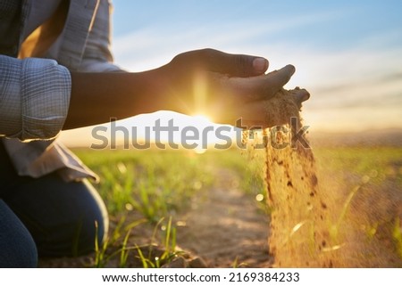 Proud of my produce. Cropped shot of a farmer holding soil. Royalty-Free Stock Photo #2169384233