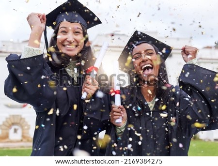 Queue the celebrations. Cropped portrait of two attractive young female students celebrating on graduation day. Royalty-Free Stock Photo #2169384275