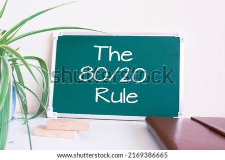 Text The 80 20 Rule written on the green chalkboard Royalty-Free Stock Photo #2169386665