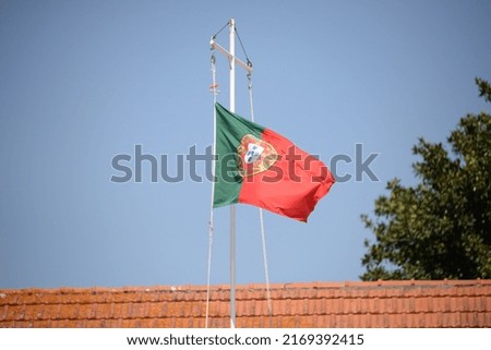 the portuguese flag in the wind in Cascais -  Portugal 