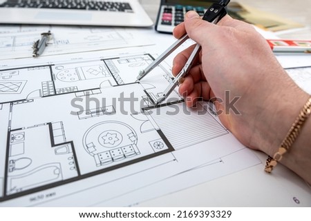 a young designer takes a project where you need to choose colors for a certain drawing of a new house. New building design concept