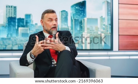 Talk Show TV Program Presenter and Celebrity Interview. Portrait of Handsome Male Host or Guest Expert Talk Politics, Science, News, Entertainment. Mock-up of Cable Channel Television Studio Royalty-Free Stock Photo #2169396063