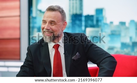 Talk Show TV Program, News Discussion: Cheerful White Male Presenter Talks, Listens to Guests. Cable Channel Host or Guest Have Conversation. Mockup Television Studio and Entertainment Concept