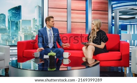 Talk Show TV Program: Two Charismatic Presenters Talk. Cable Channel Hosts Have Conversation, Chat, Discuss News, Interview Guests, Have Fun. Mockup Television Studio, Newsroom Entertainment Concept Royalty-Free Stock Photo #2169399289