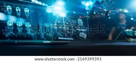 Doctor surgeon and neurologist use robotic and medical technology diagnose and examine patient brain with intelligence software. AI, Innovation, Science and technology digital medical healthcare.  Royalty-Free Stock Photo #2169399393