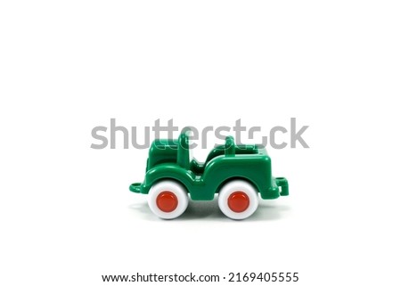 Army car open roof green paint plastic toy isolated on white background